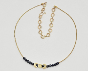 Handmade gold moon phase necklace with sapphire beads on bullion wire.